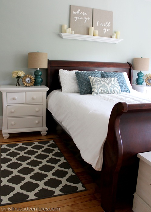 Dark sleigh bed with white nightstands