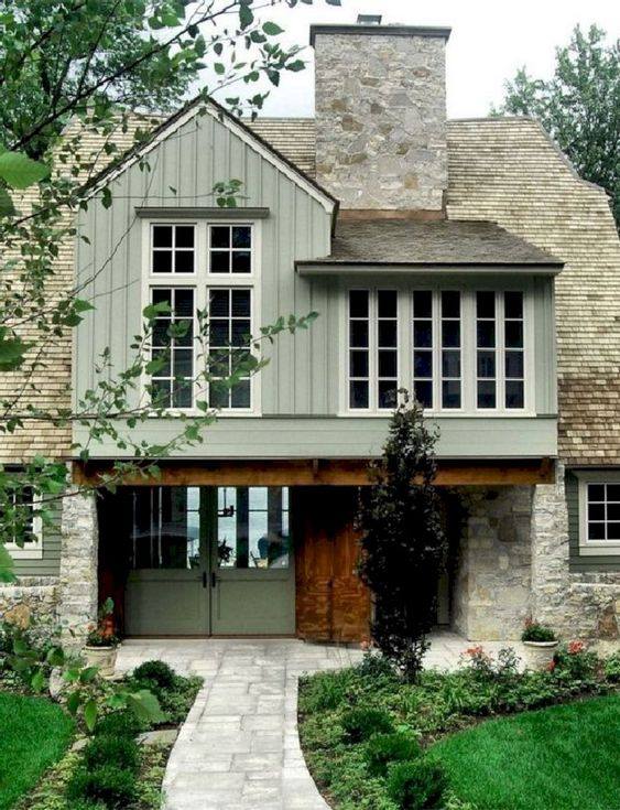 sage green exterior with stone and wood accents
