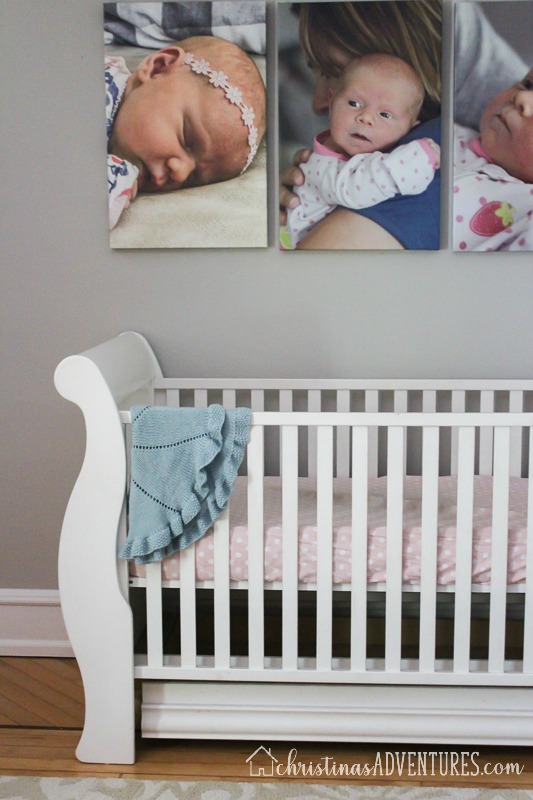 white crib with oversized canvas prints