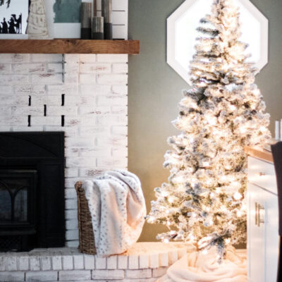 cropped-Flocked-christmas-tree-with-white-lights-scaled-1.jpeg