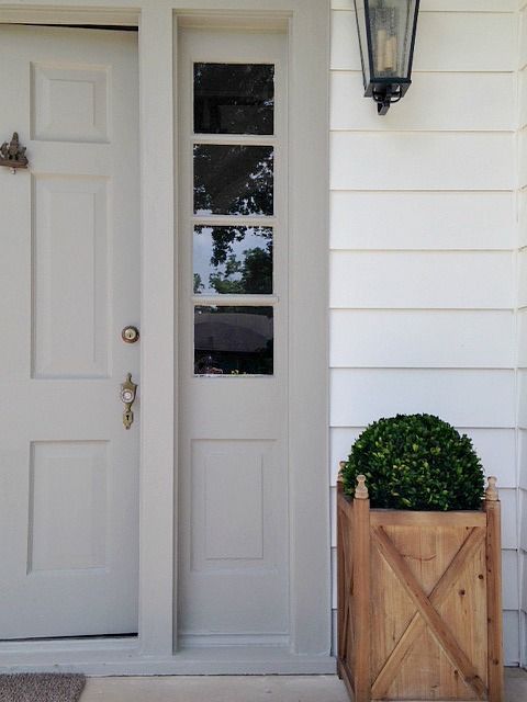 Holly Mathis neutral front door with wood planter