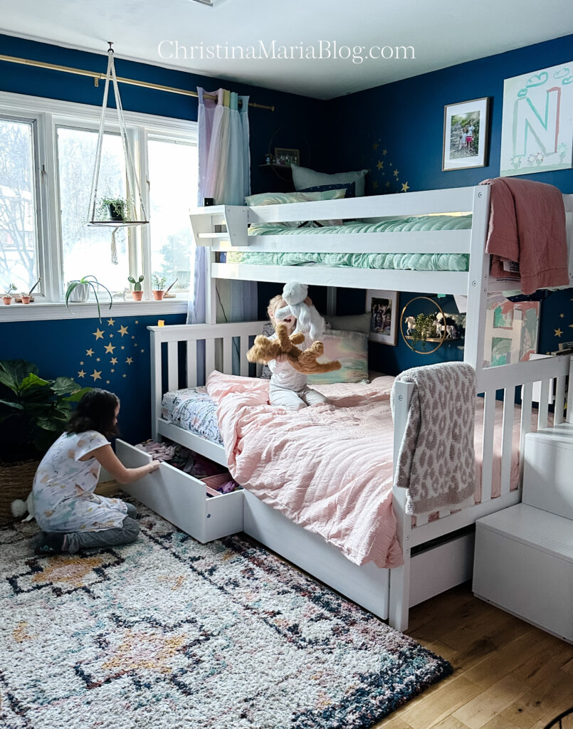 girls bedroom with blue walls and bunk bed