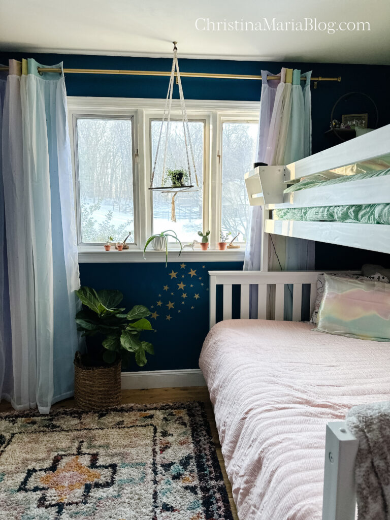 girls blue bedroom with stars and bunk bed